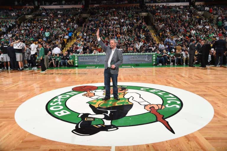 Rusty Sullivan standing at center court of the TD Garden waving to fans